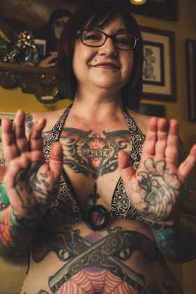 woman showing body tattoo